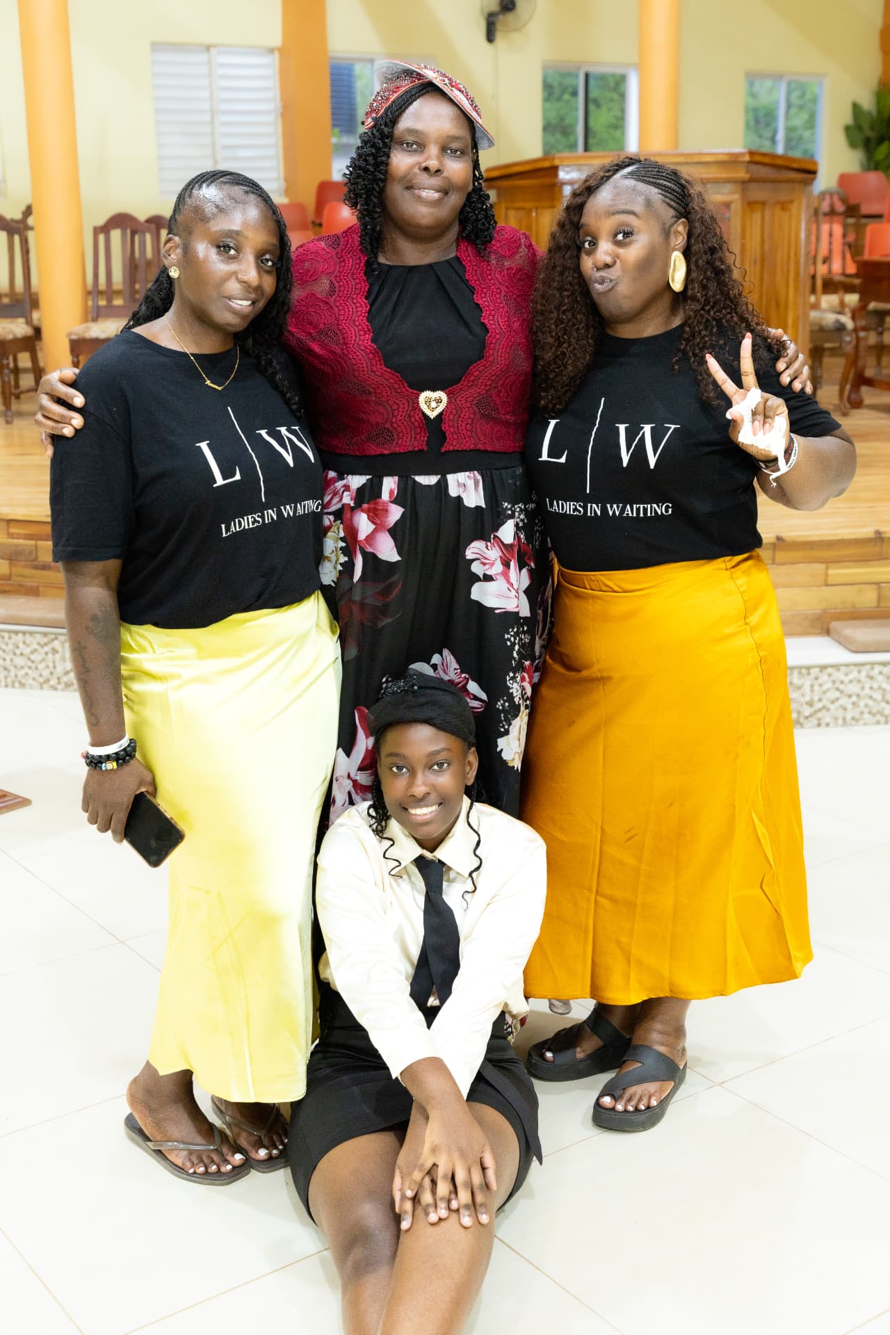 LIW Jamaica team members with a guest and a young attendee after the launch
