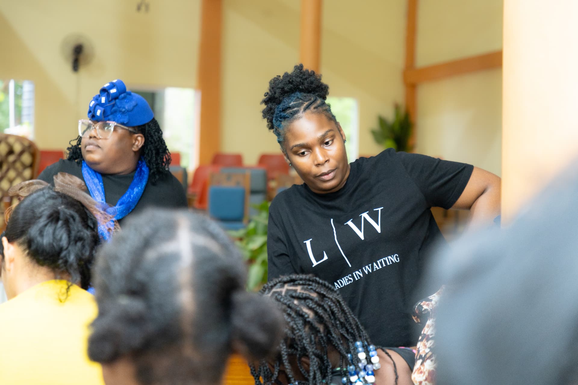 Two LIW Jamaica volunteers listening during a small group conversation