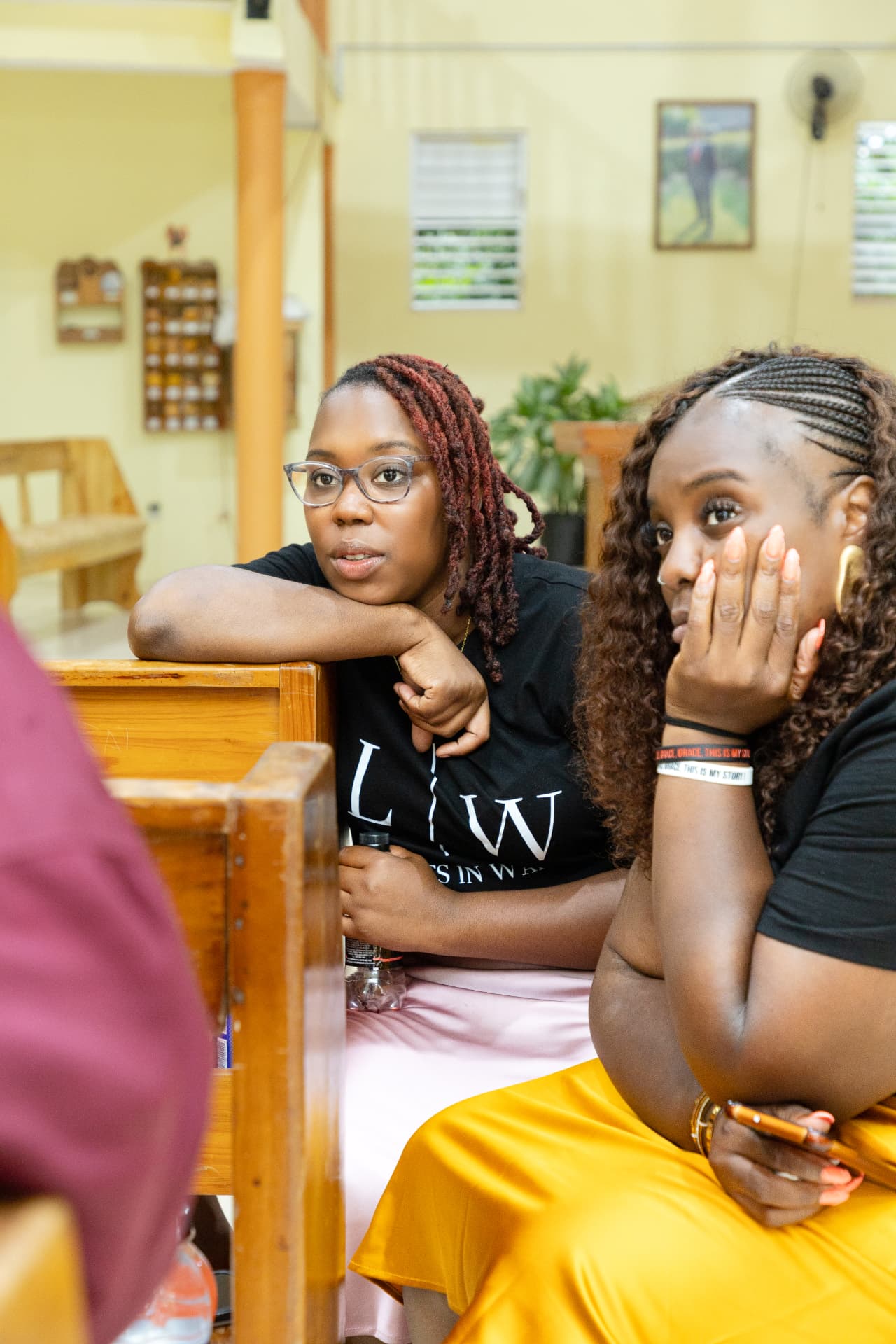 Two LIW Jamaica volunteers listening during the discussion