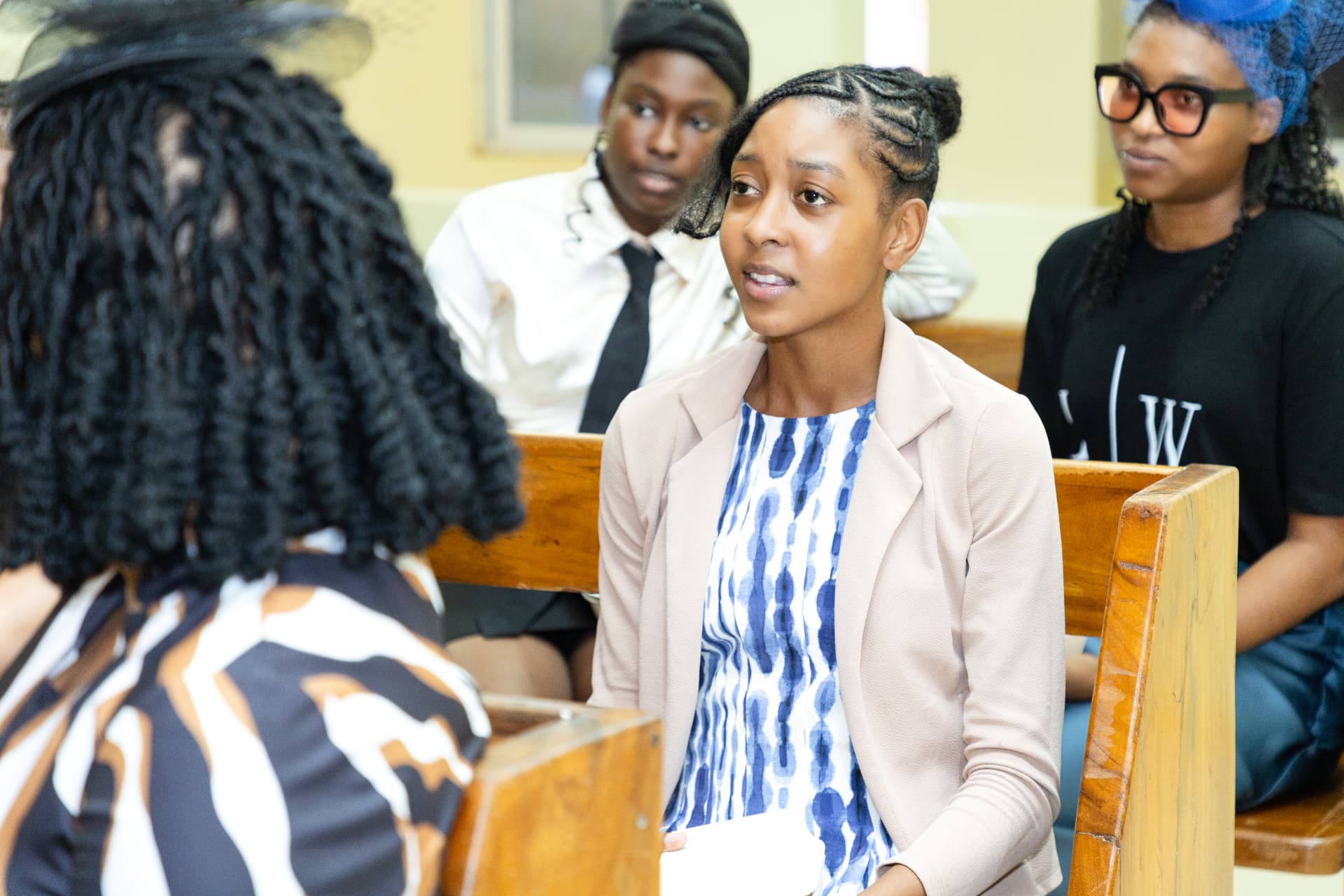 A young woman sharing her thoughts during the launch discussion