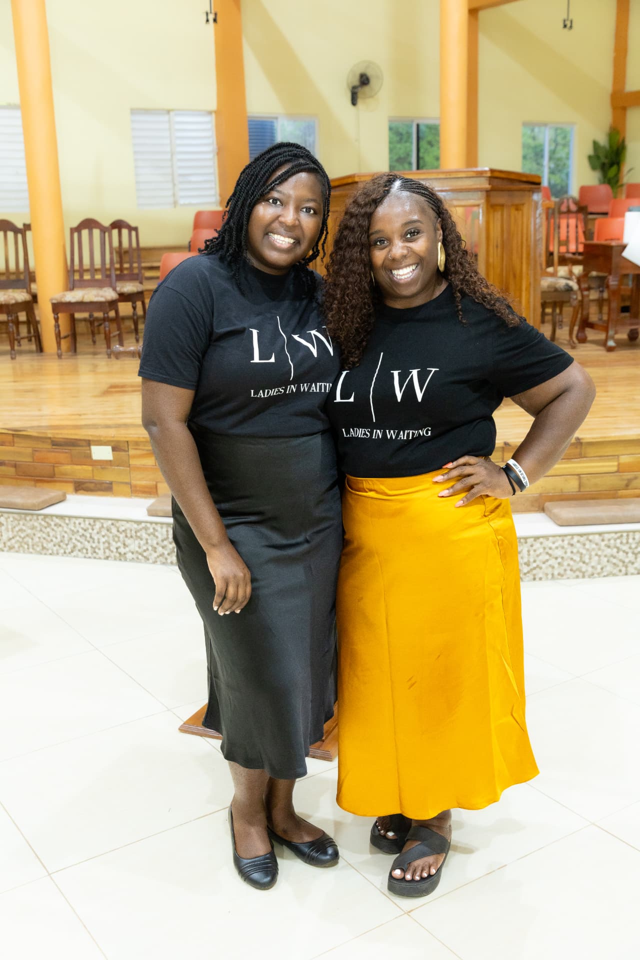 Two LIW Jamaica team members smiling together at the launch