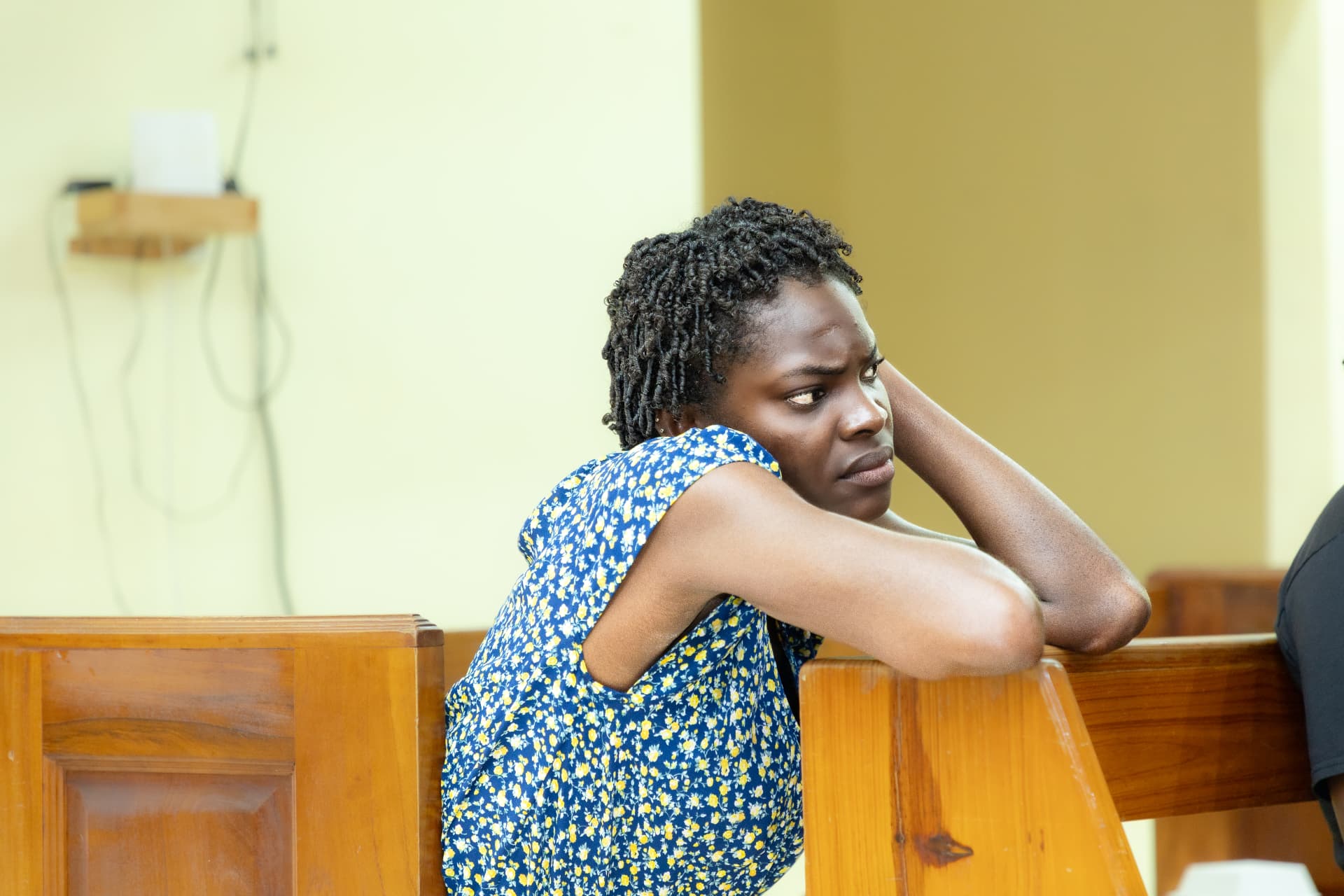 A young woman listening thoughtfully during the launch session
