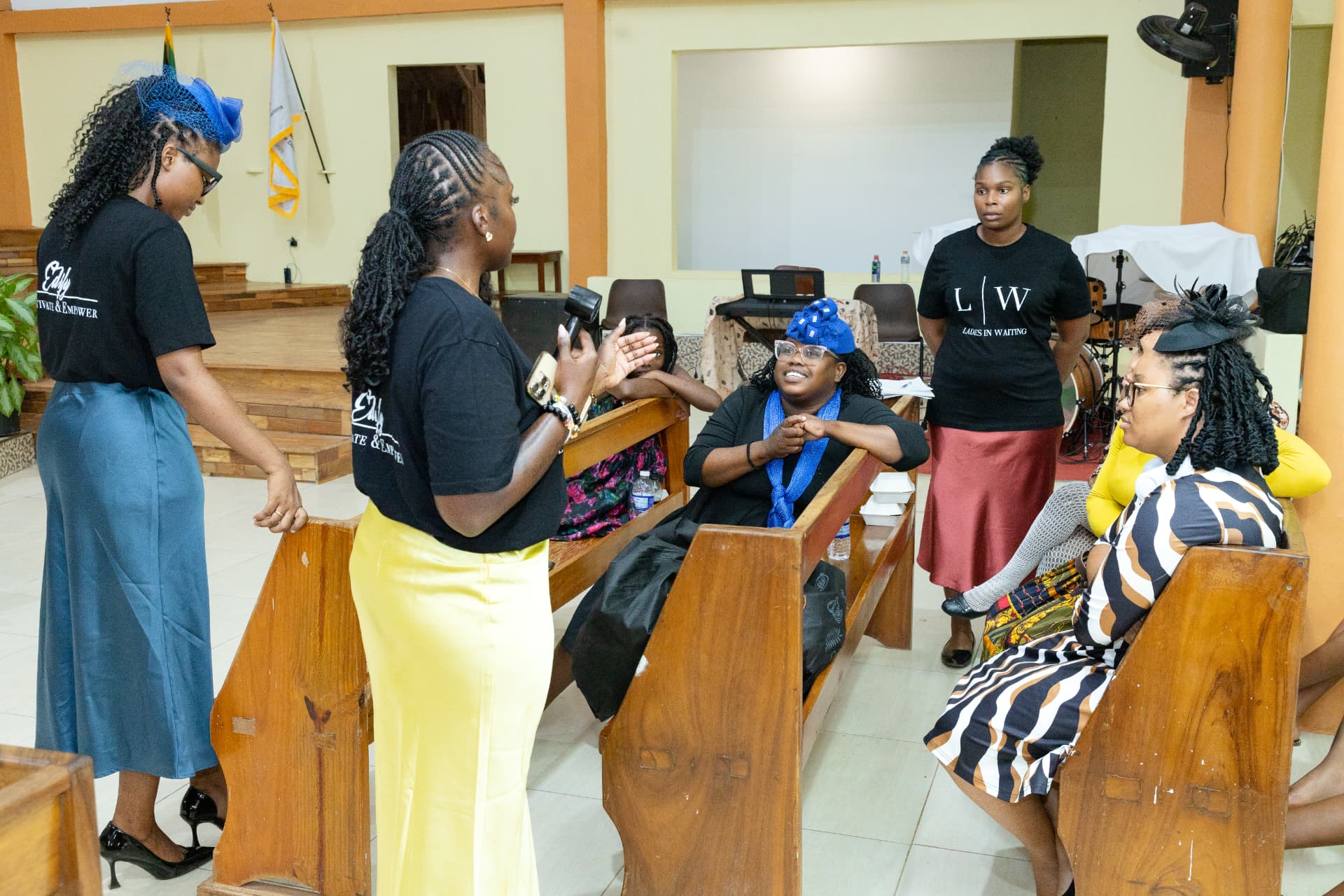 LIW Jamaica hosts leading a group discussion with attendees in the pews